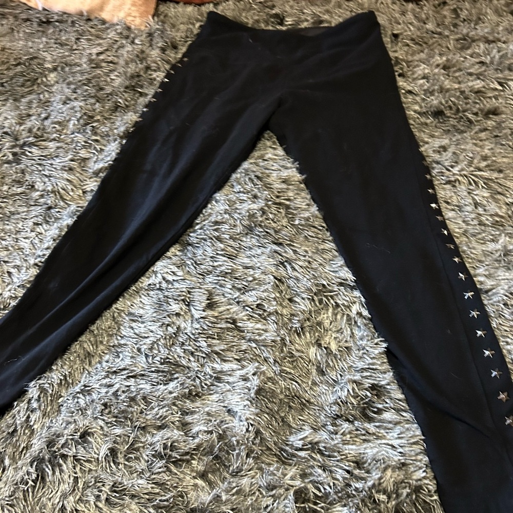 Black fitting pants with star studs